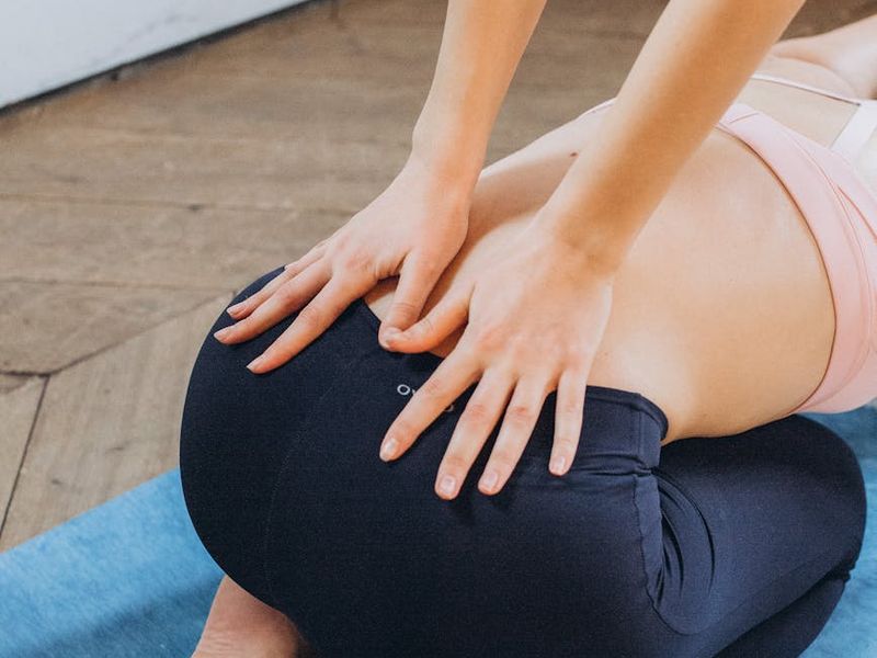 Close-up of hands on a yoga mat during practice